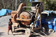 Child in front of construction machine