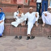 A Christian, a Muslim, and a Hindu all sitting in a row.