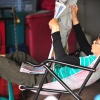 Older lady reading newspaper