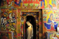 Inside the church, the murals were beautiful. Only the priests could go past the door.